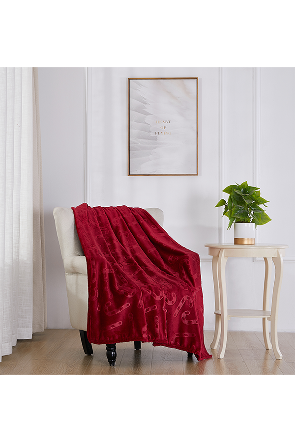 x Embossed Candy Cane Christmas Throw $. lifestyle shot